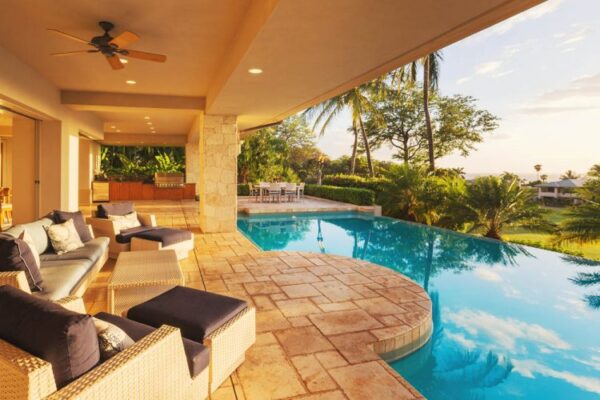 Beautiful water pool in a house Beautiful swimming pool overlooking tropical garden